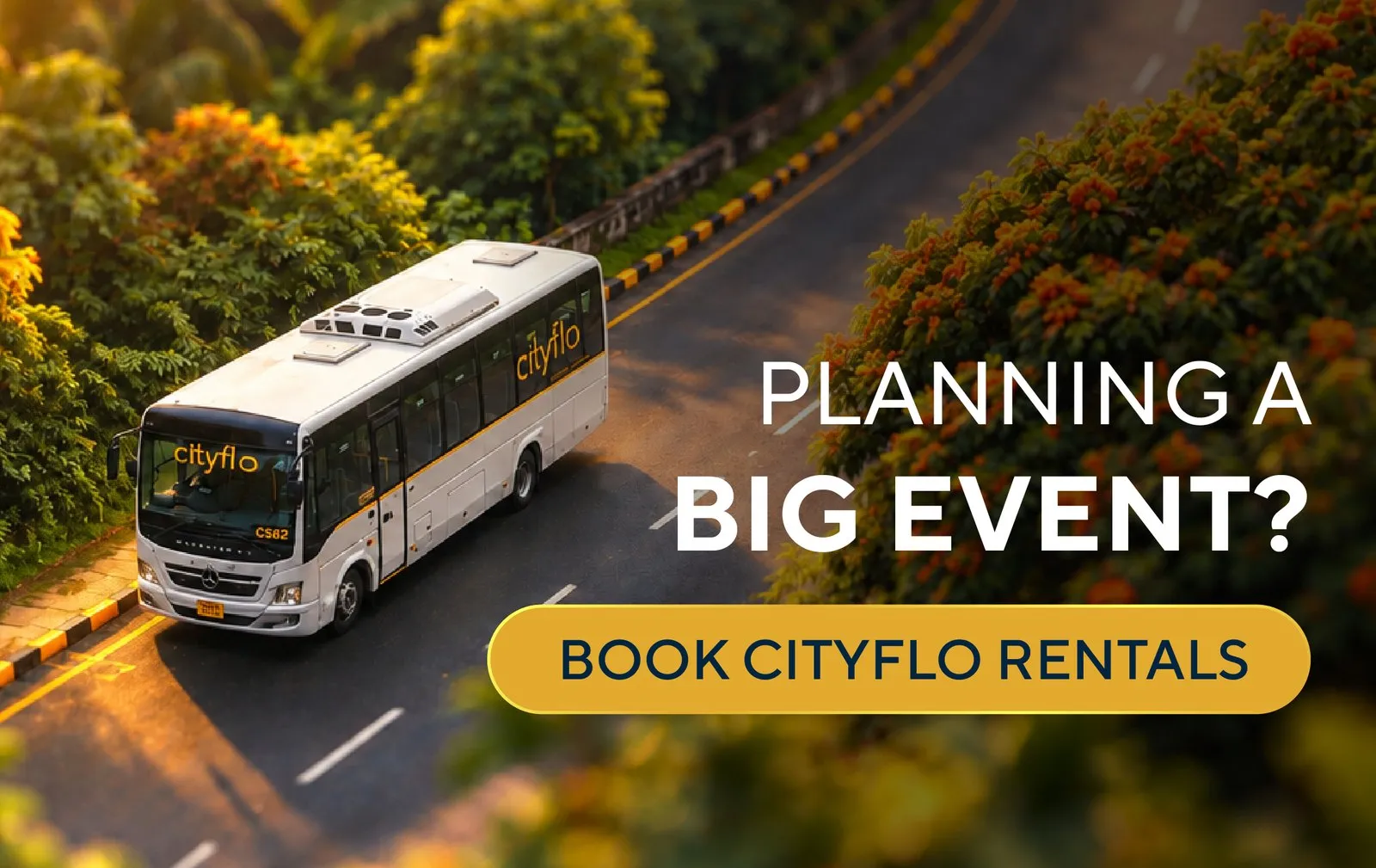 A Cityflo bus on a tree-lined road, for big events
